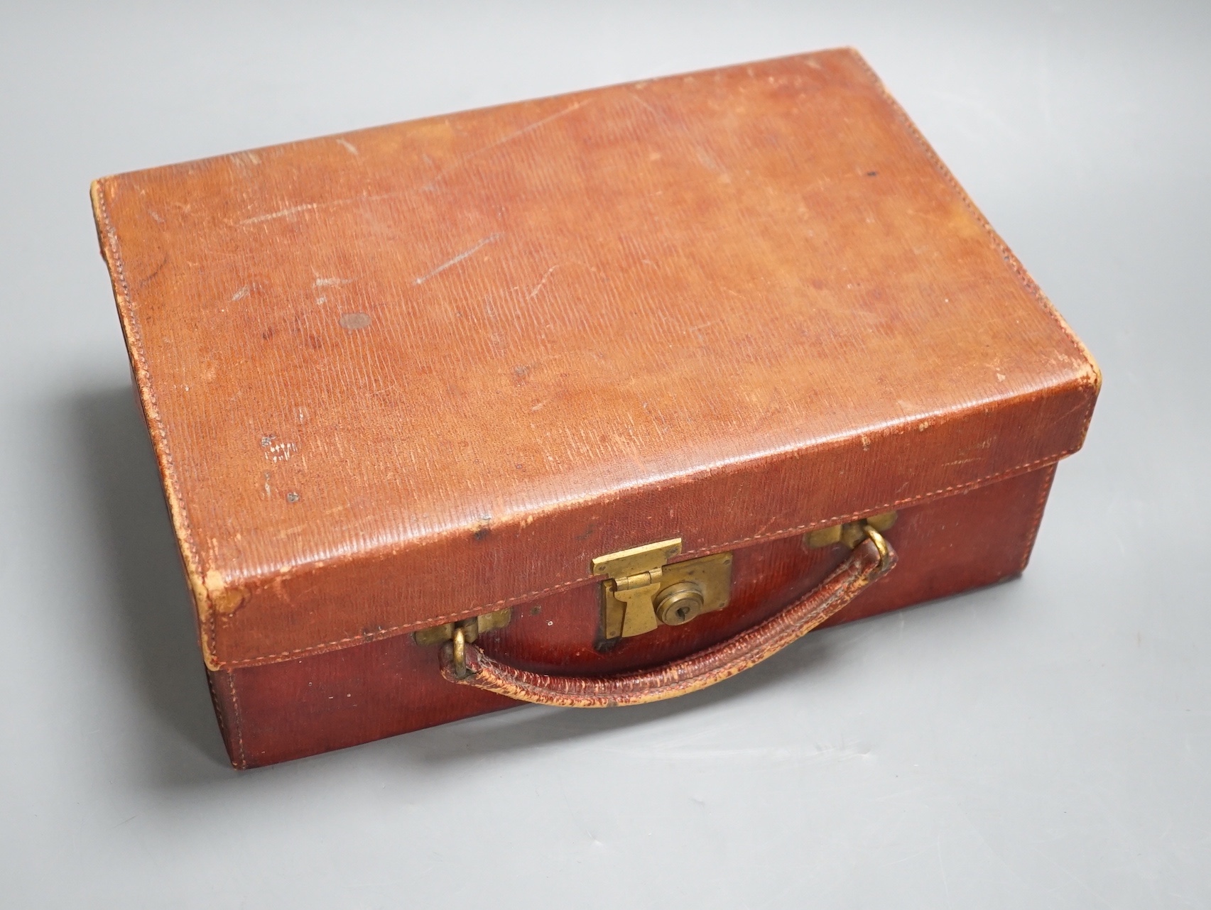 A Vintage Asprey red leather case, 28cm